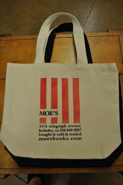 Item #200214 Moe's White Canvas Bag (Stripes). Moe's Books.